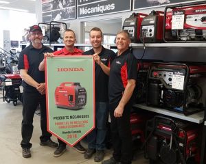 L'Ami Denis receives an award from Honda Canada